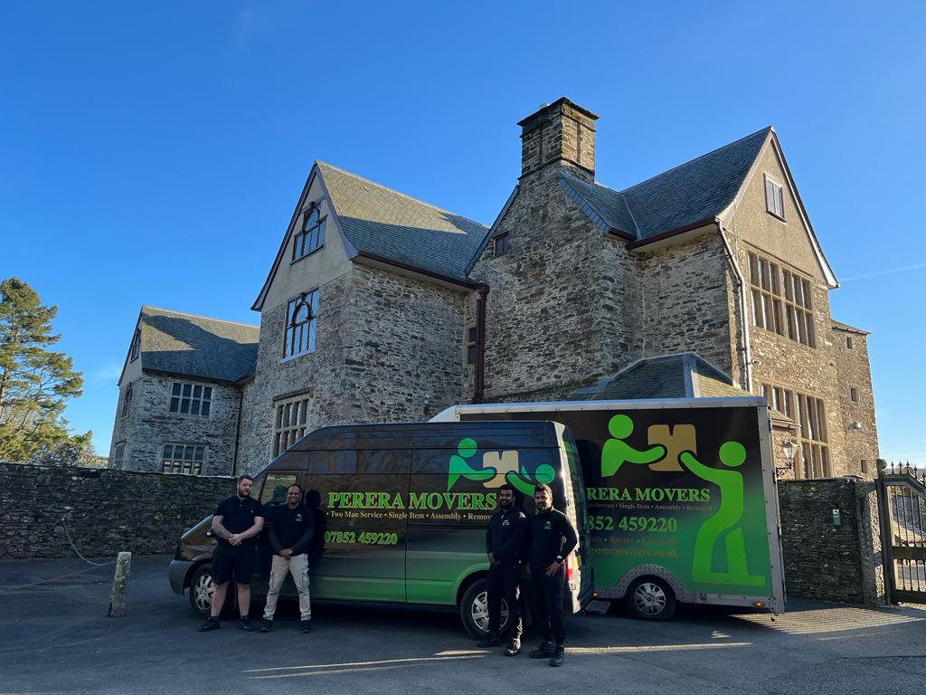 Team perera movers standing next to vans